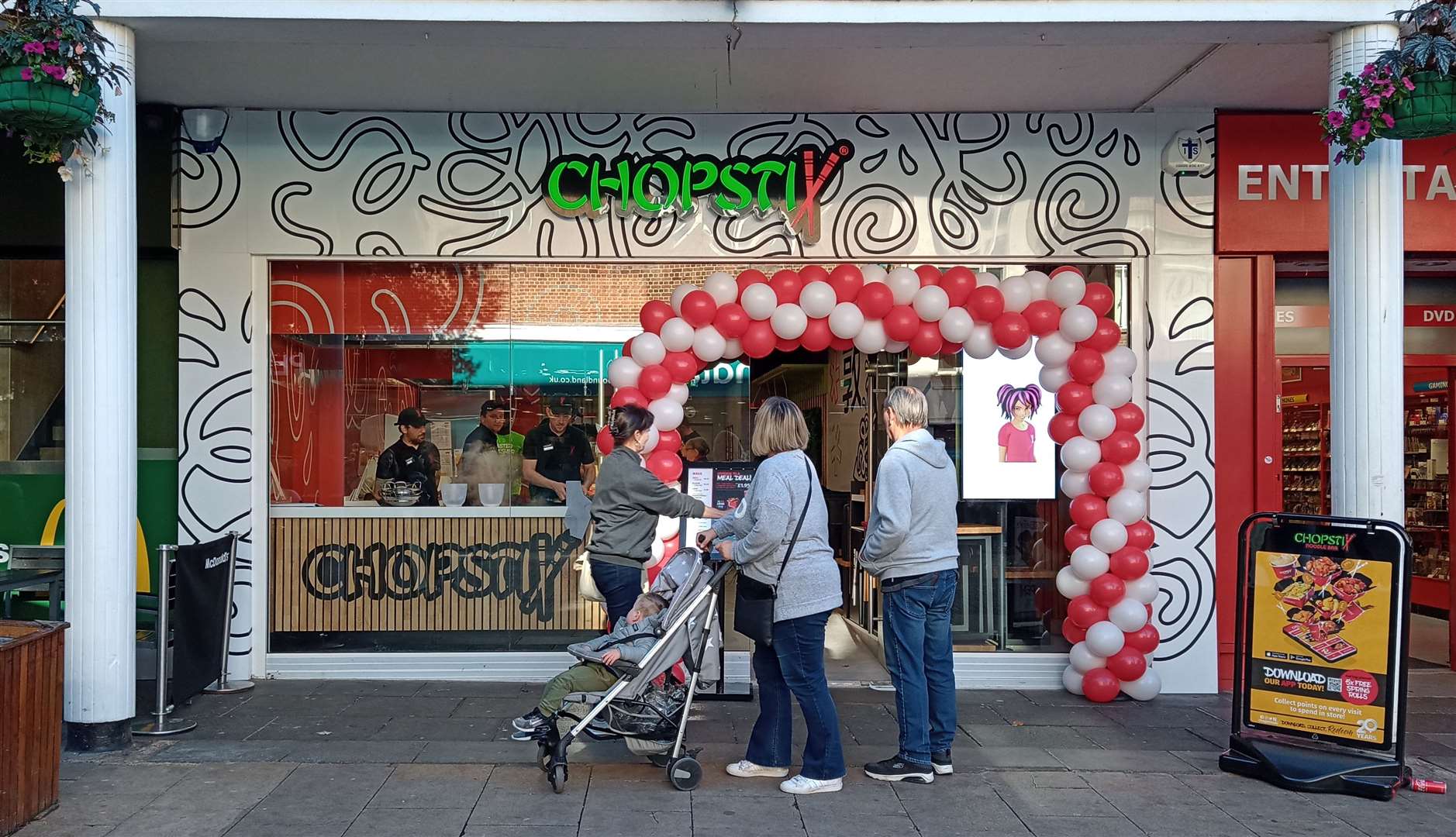 Passers-by peek into Chopstix, Canterbury