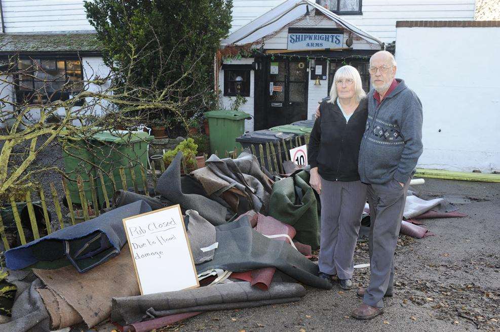 Ruth and Derek Cole outside The Shipwright's Arms near Oare after a tidal surge flooded the pub in December