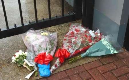 Floral tributes left the premises where the dead man was employed. Picture: JIM RANTELL