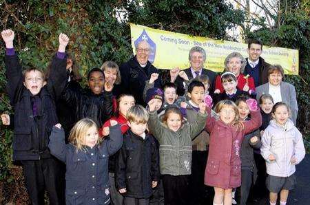 The School Council from All Saints Primary celebrate with the former Mayor and Govenors at the purchase of the new site that will accomodate both schools
