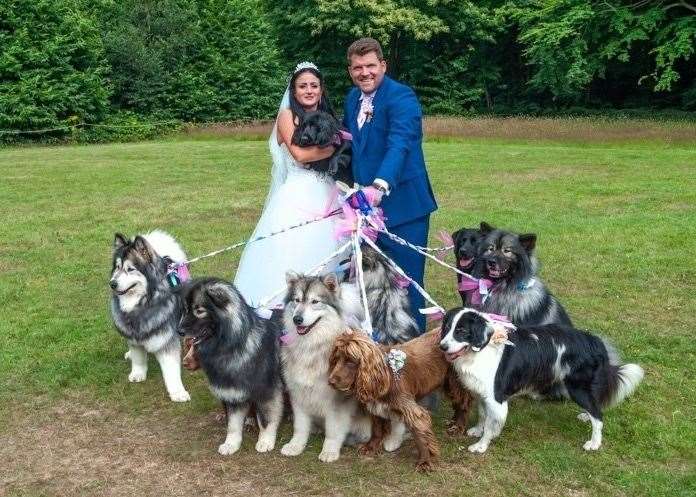 Kelly and Billy Bleach with their pack of wedding guests