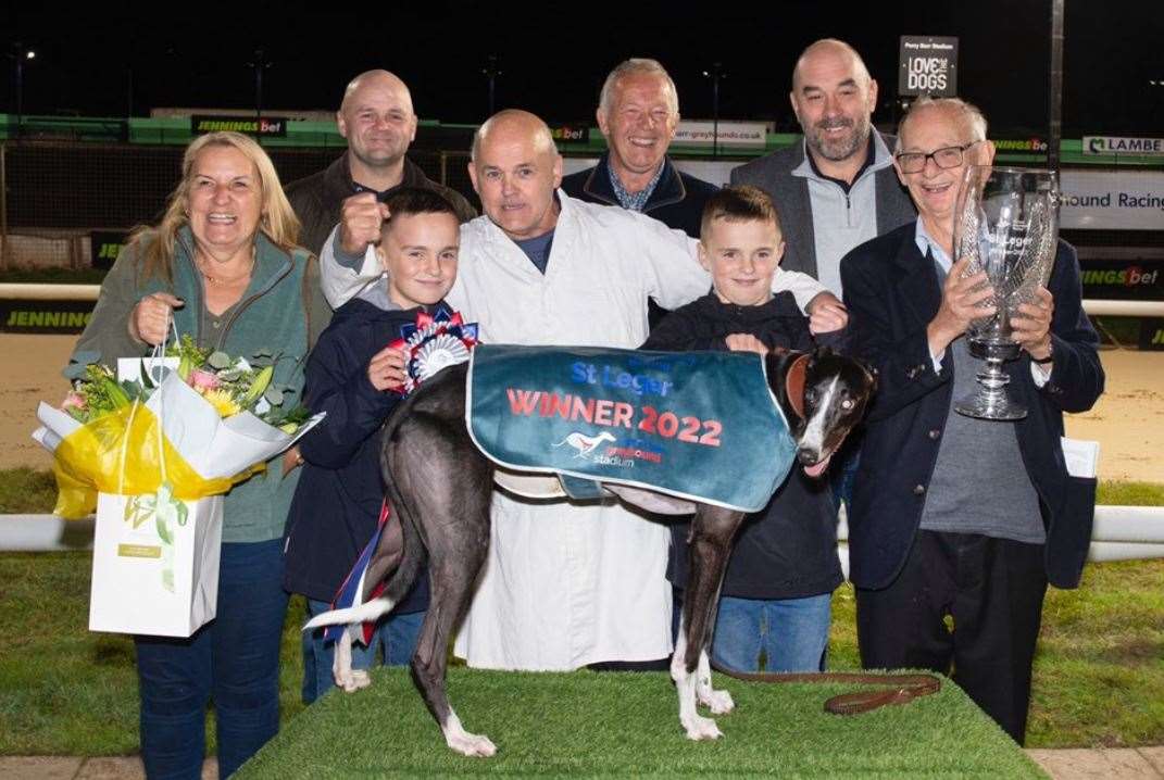 Rab McNair with connections and his runner Havana Lover - one of two entrants for the Ashford greyhound trainer at this weekend's Golden Jacket Final. Picture: Premier Greyhound Racing