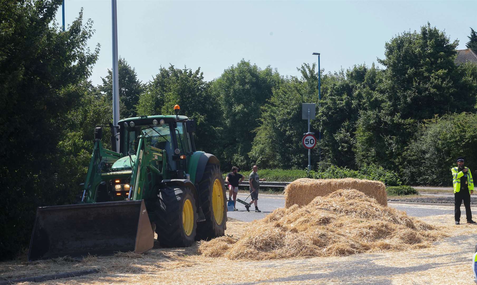 Grange Roundabout in Gillingham was closed due to a fallen load of hay. Images UKNIP