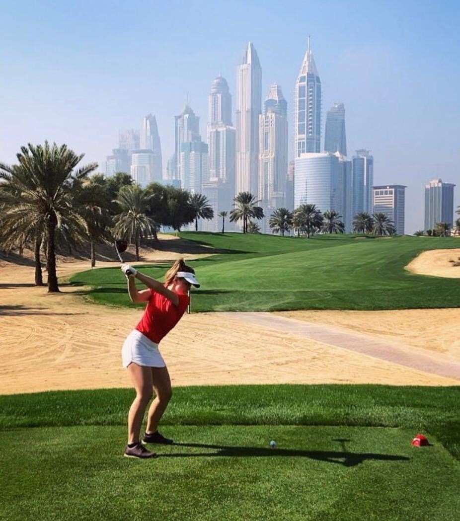 Oliva Cooke playing golf in Dubai