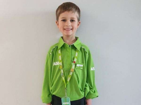 Luca Grose dressed in an Asda uniform for his school superhero day
