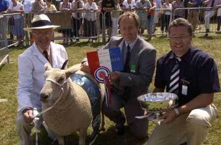 SUPREME SHEEP AWARD: John Griffiths (Gloucestershire), Howard Bates (judge), and Andrew Sharp (Marks & Spencer).