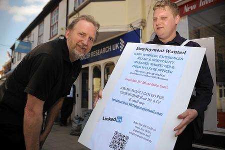 Unemployed Ben Martin takes to the streets of Faversham with a sandwich board looking for a job.