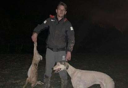 Jimmy Price with a hare killed by his dogs