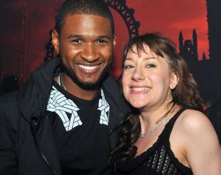 No wonder she's smiling! Katie Teague with her hero Usher.