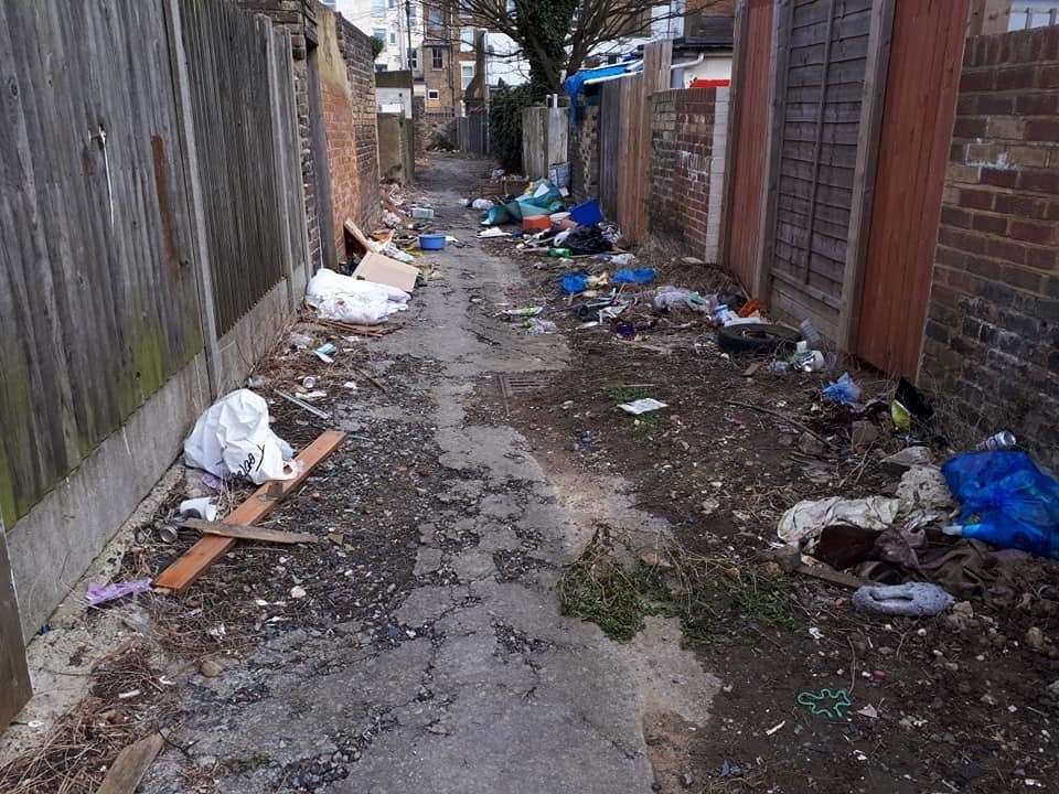 Fly tipping and waste strewn in alleyways between Elthelbert Road and Athelston Road in Margate (8433323)