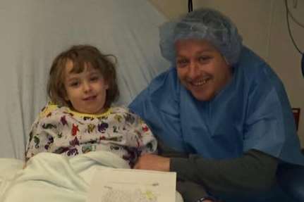 Paige with her dad, just before the operation