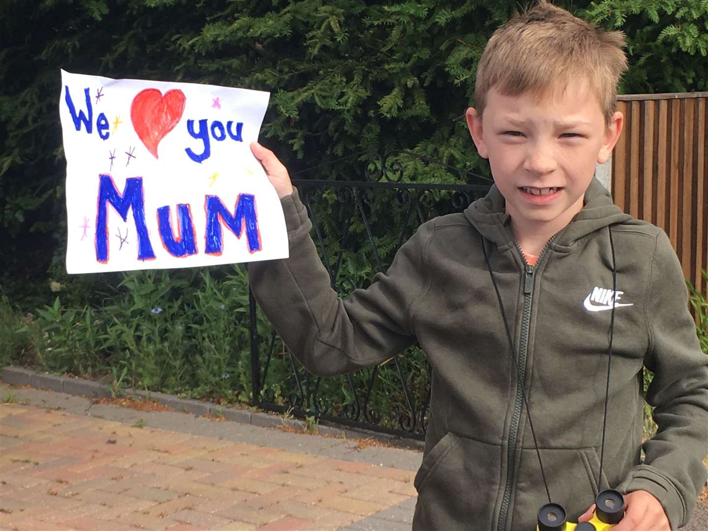 Samuel Nurden waiting for his half-marathon mum Tina