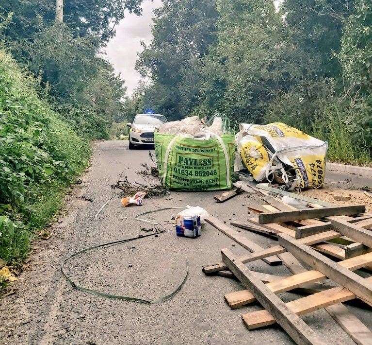 Police were called after a massive mound of rubbish was found blocking Cotton Lane, Dartford. Photo: @KentPoliceDart