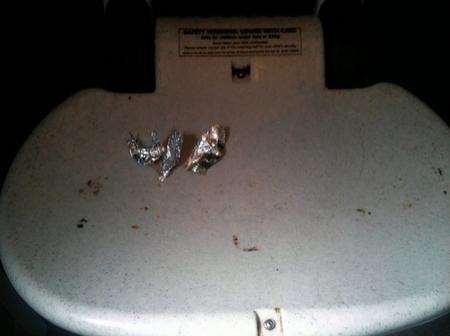 Burnt foil used for cooking up heroin on top of the baby-changer at the Tower Way toilets.