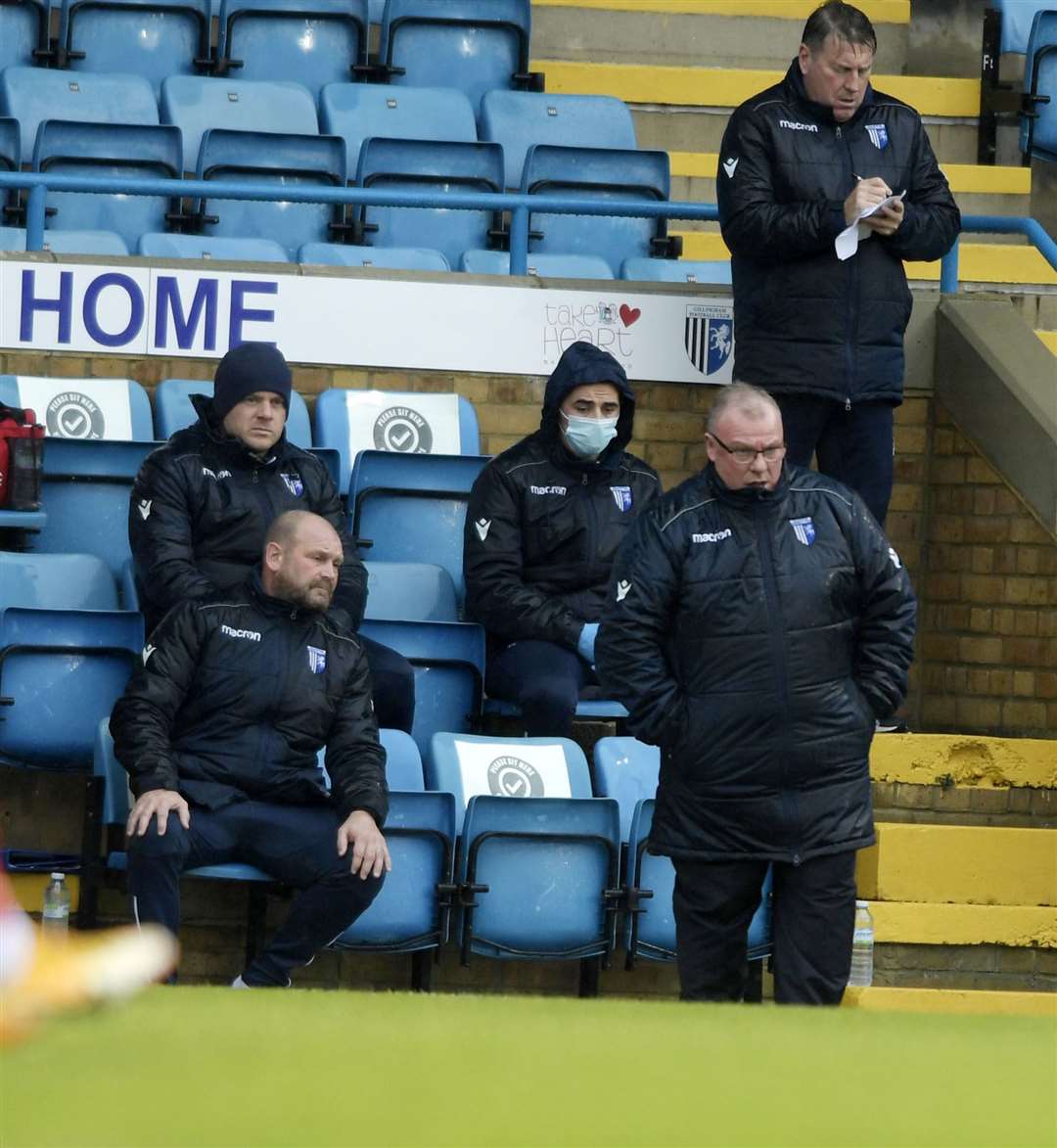 Gillingham boss Steve Evans and the management team watch on at the weekend Picture: Barry Goodwin