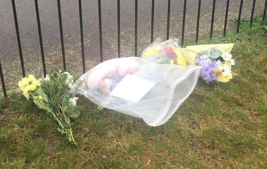 Floral tributes have been left near the house (6242126)