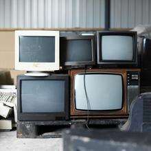Old TV screens and computer monitors. Picture: George Doyle