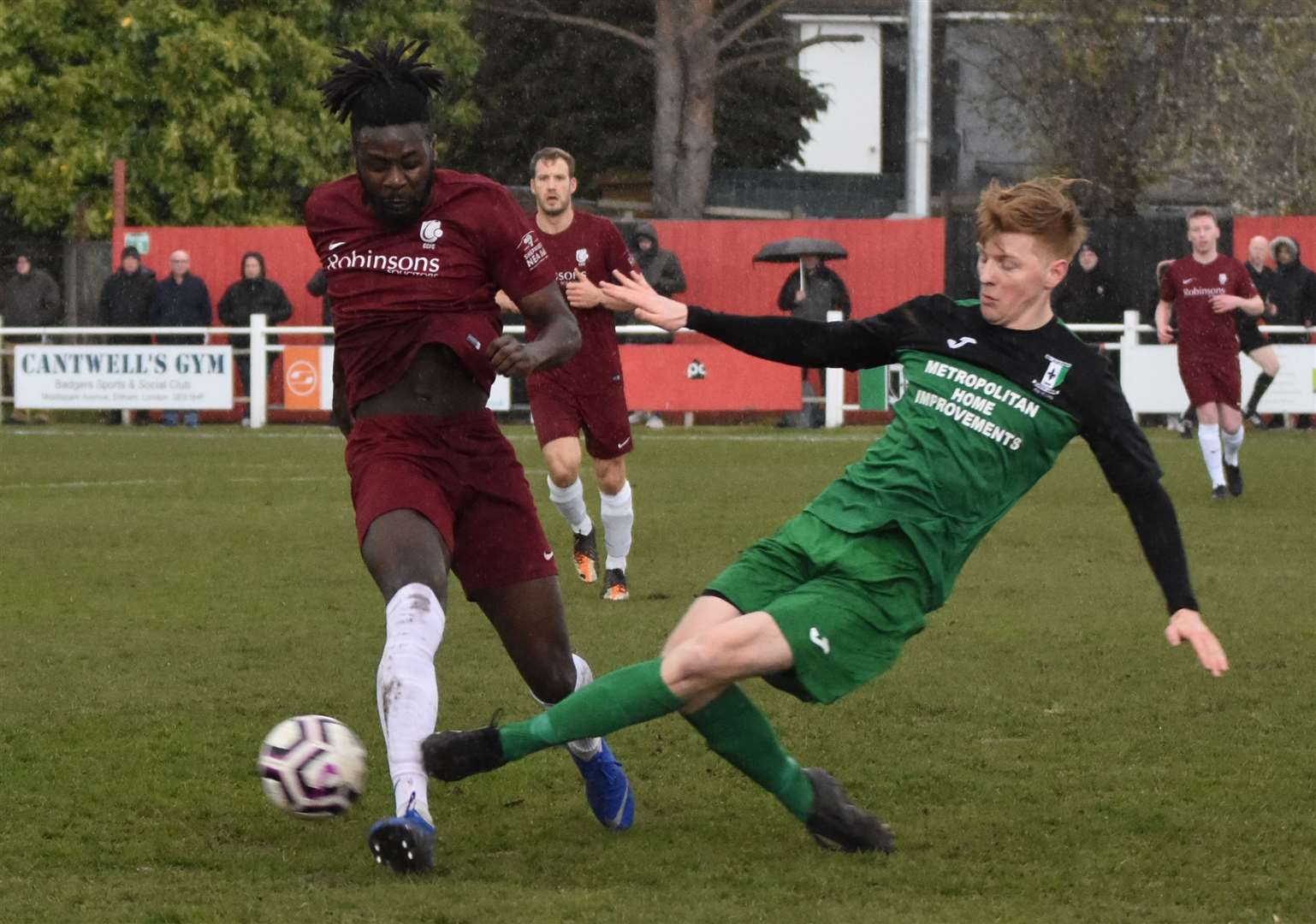 Canterbury's Bola Dawodu is challenged during the semi-final first leg at Cray Valley Picture: Alan Coomes