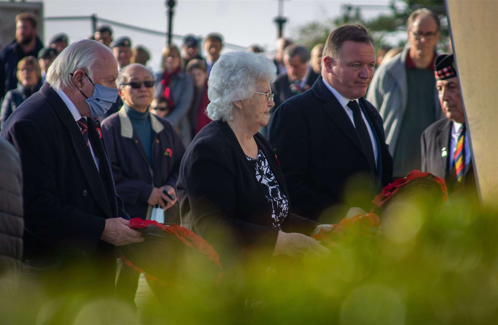 Cllr David Monk, Cllr Anne Berry and Damian Collins lay wreaths last year. Picture: Tom Bishop