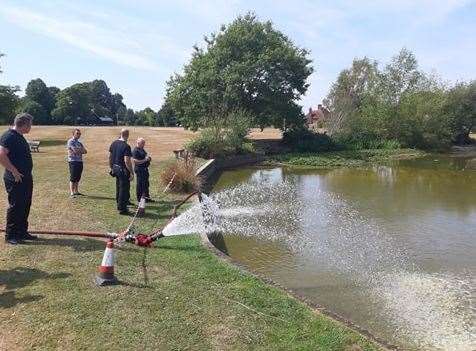 Kent Fire and Rescue crews from Tonbridge fire station used their hoses to refill Matfield village pond which was in danger of drying out