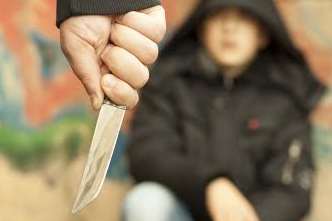 The teenager was armed with a knife. Stock image