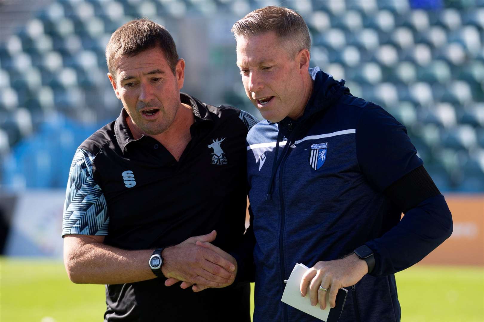 Gillingham manager Neil Harris with Mansfield boss Nigel Clough Picture: @Julian_KPI