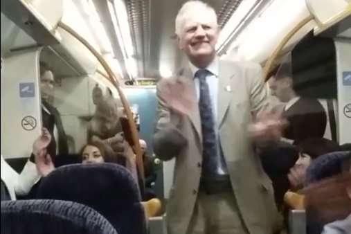 Passenger Martin Clews during a sing-along on a Southeastern train