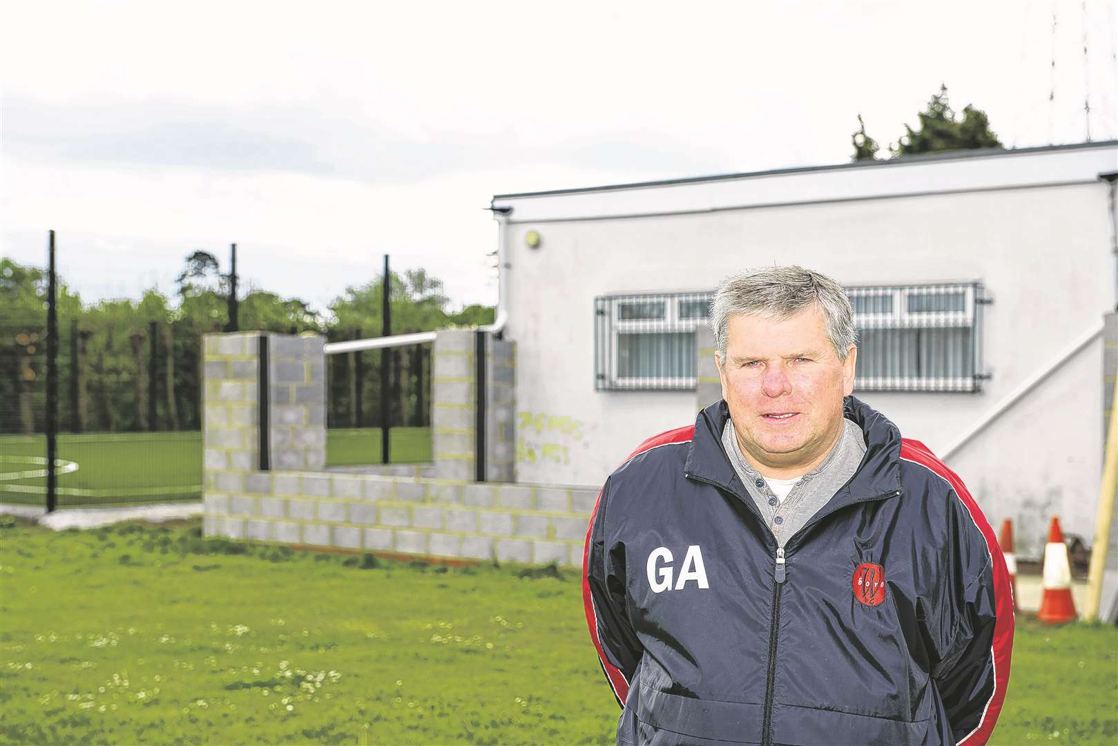 Chairman Gary Ambrose in front of the club house