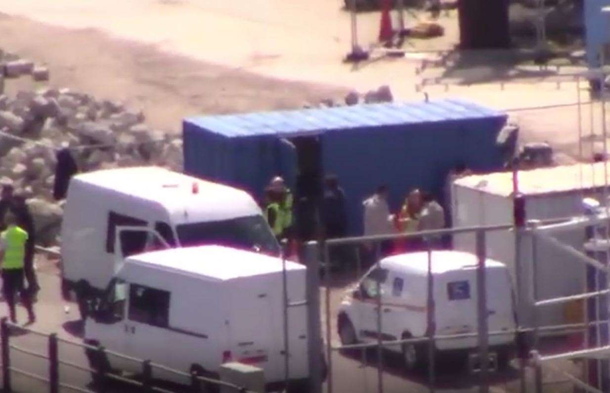 Suspected migrants wrapped in blankets were filmed standing with officials in Dover. Picture: Carly Morris (11564780)