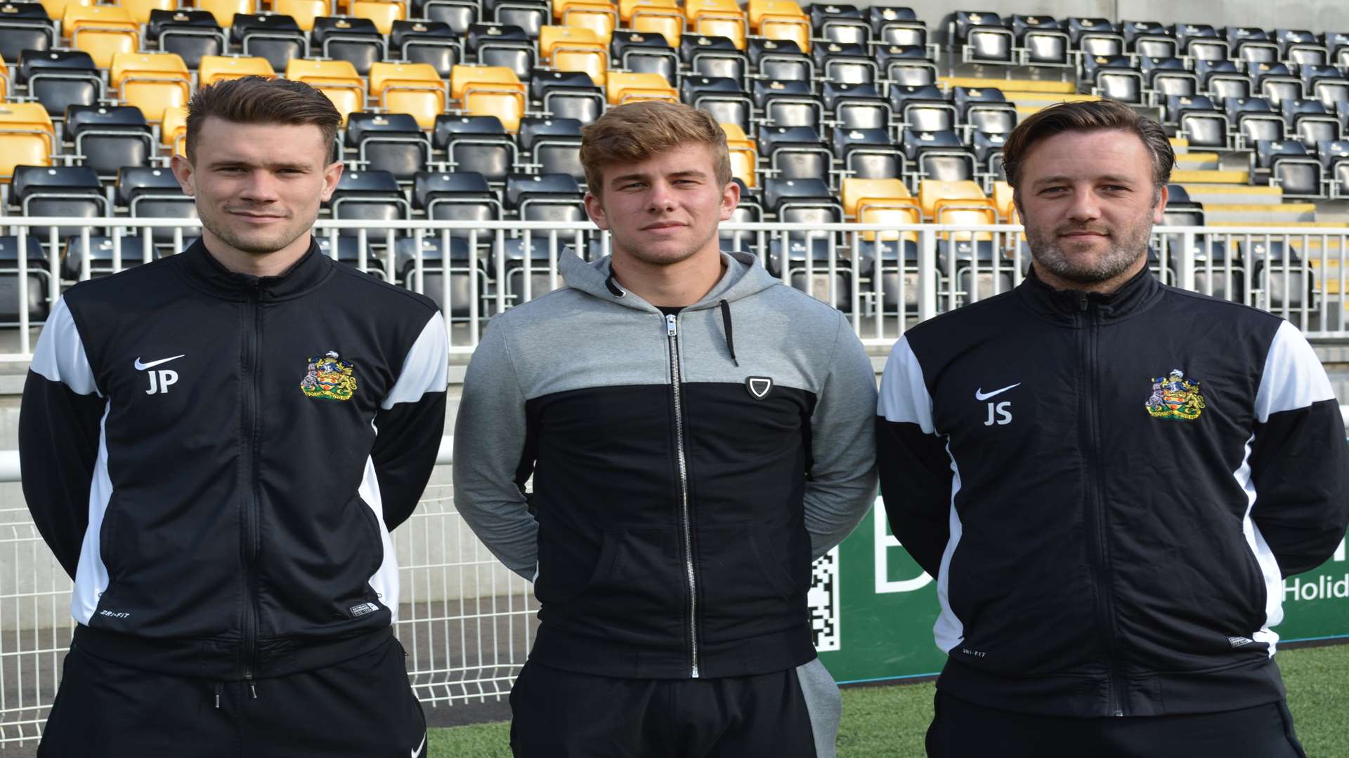 Ben Swift (centre) with academy manager Jack Parkinson and first-team boss Jay Saunders on his last day at Maidstone on Monday