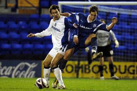 Gills Simon King clashes with Rovers Gareth Taylor. Picture by Matthew Walker