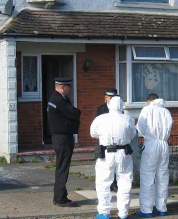 Forensics officers outside the house in Canterbury