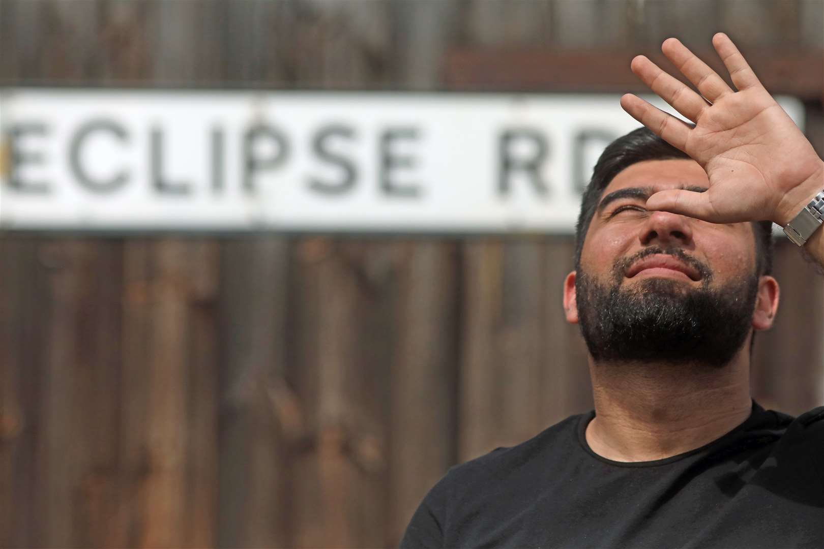 Hamza Qureshi on Eclipse Road, in east London, during a partial solar eclipse (Luciana Guerra/PA)