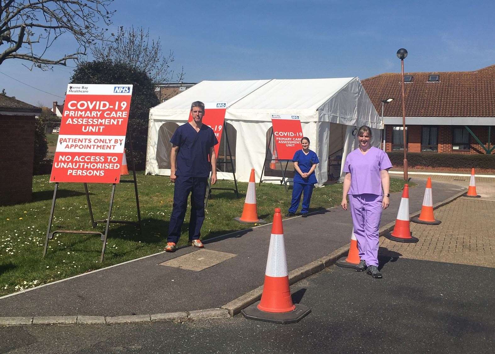 Dr Carter (left) stands outside the new assessment centre with fellow medics. Picture: Jeremy Carter