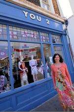 Owner Michelle Gobbi with the window of You 2, dressed by group Phoenix
