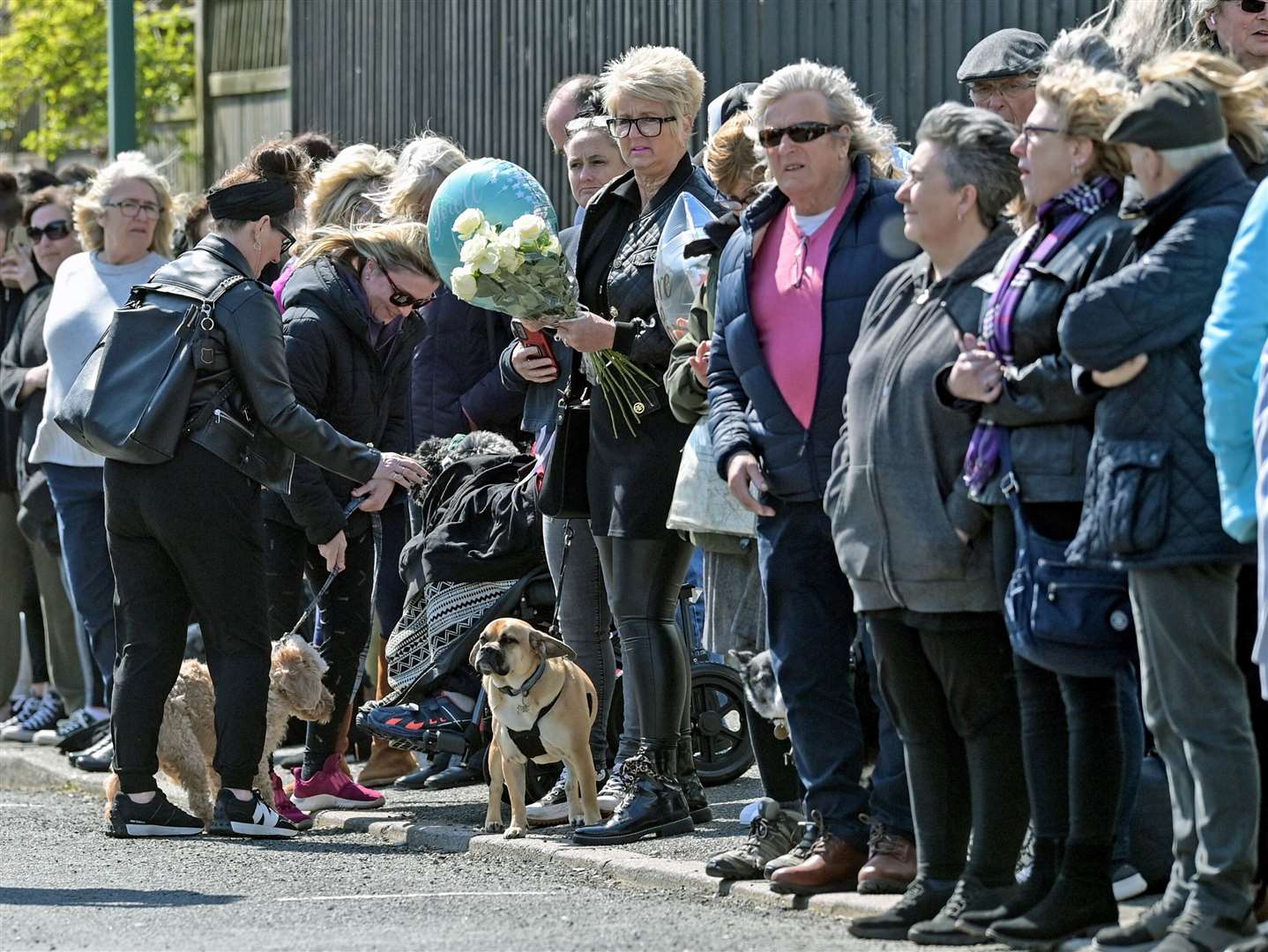 Scores of fans lined the streets for Paul O’Grady’s funeral procession. Picture: Stuart Brock