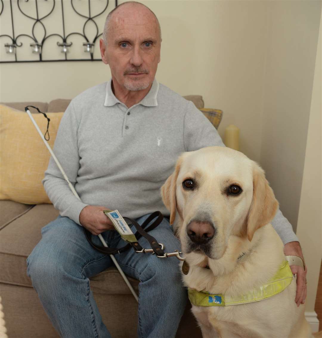 Rob Daniels and his guide dog Bob of Elizabeth Court, Twydall. Picture: Chris Davey