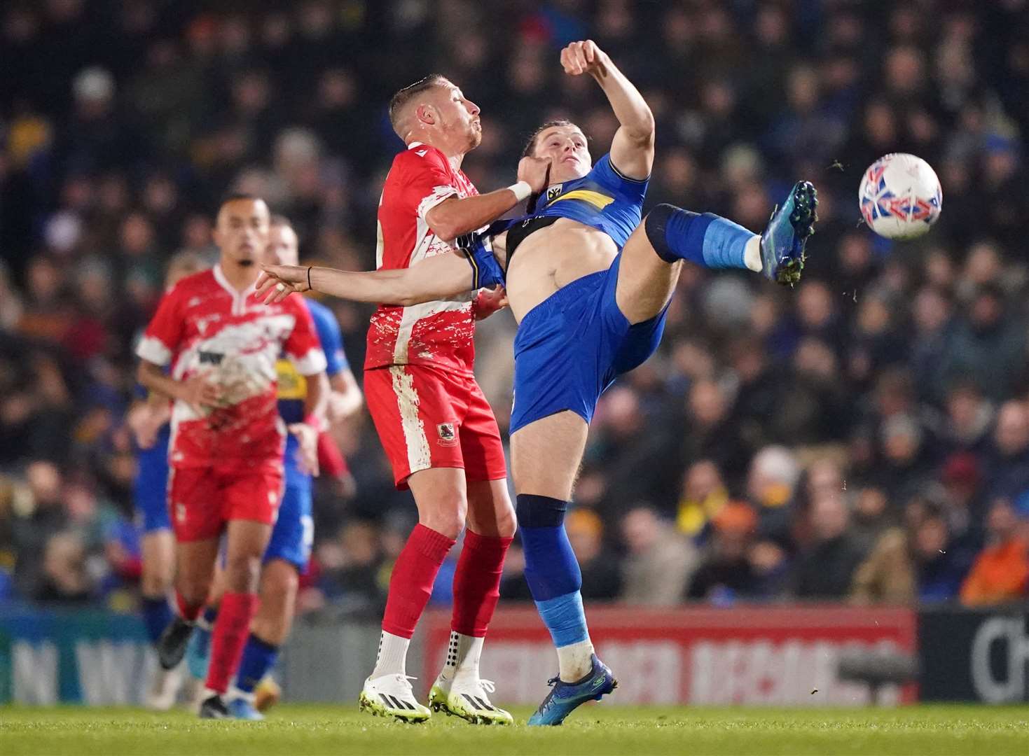 AFC Wimbledon's Josh Davison and Ramsgate's Lee Martin battle for the ball during their FA Cup Second-Round tie. Picture: PA Images