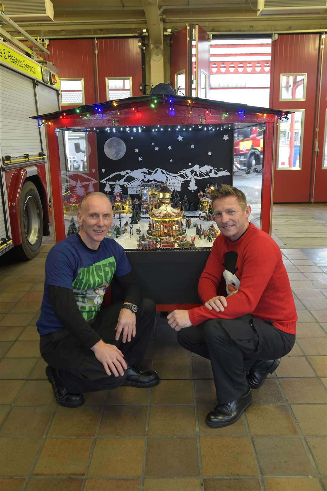 Firefighters Shane Giblin and Rob Taylor with the Christmas trailer