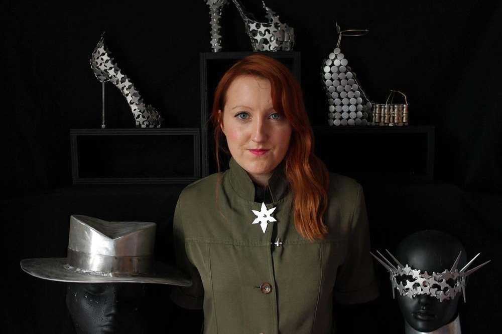 Clare Whittingham with examples of fashion accessories she's created from metal
