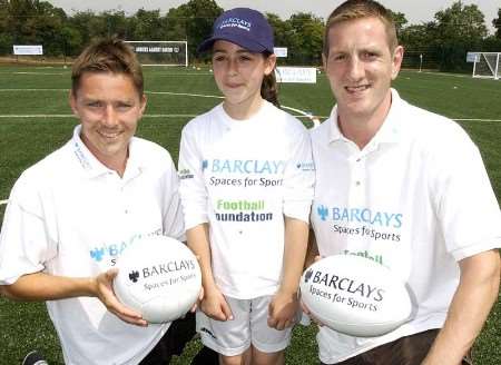 Charlton's Matt Holland (left) and England rugby star Will Greenwood with nine-year-old Roxie Watt from Heronsgate School. Picture: NICK JOHNSON
