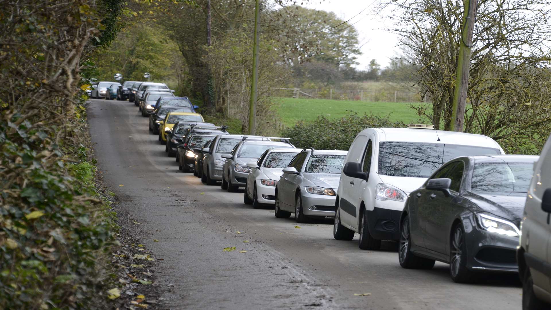 Cars back up along the lane before the funeral of Connor McDonald