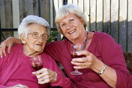 Lydia Eaton, aged 102, with her daughter Eliane Griffin, in the garden of Newington Court Care Home, Newington