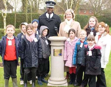 The youngsters with Mike Fuller and Ann Barnes at the unveiling of the sundial in the memorial garden