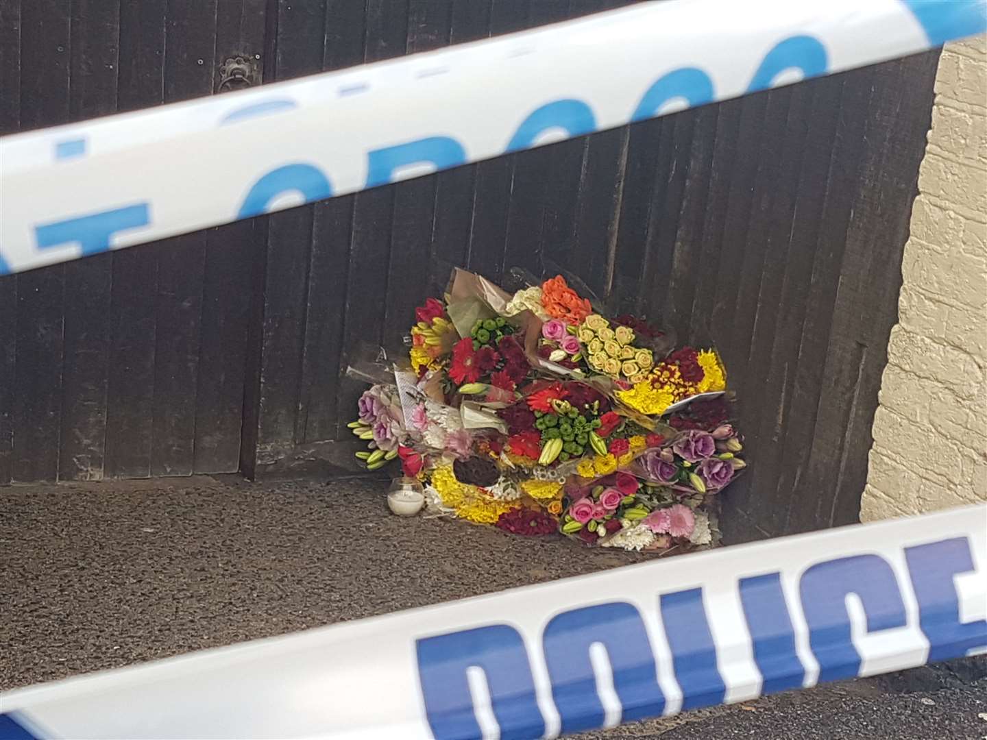 Flowers left outside the pub after Mr Daniels' death