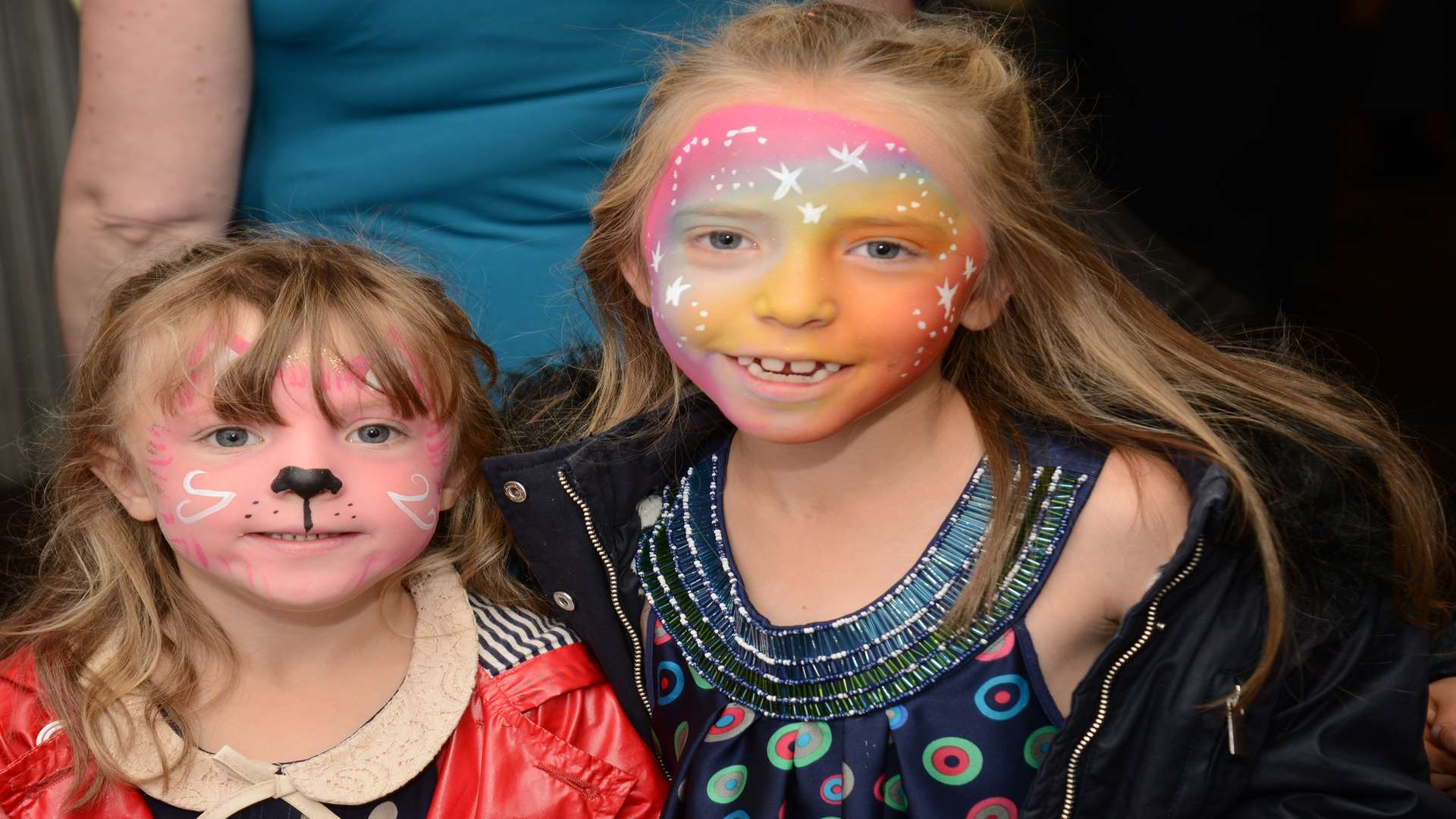 Olivia and Llana Yeatman with their faces painted