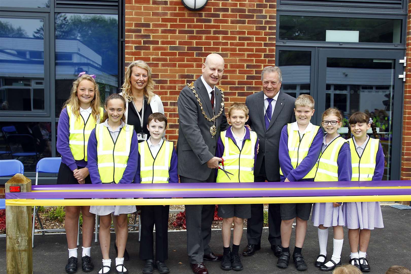 Cllr Dave Naghi, the Mayor of Maidstone, cuts the tape accompanied by Jack Keeler, chairman of governors, and Sarah Symonds, head teacher, and some of the children