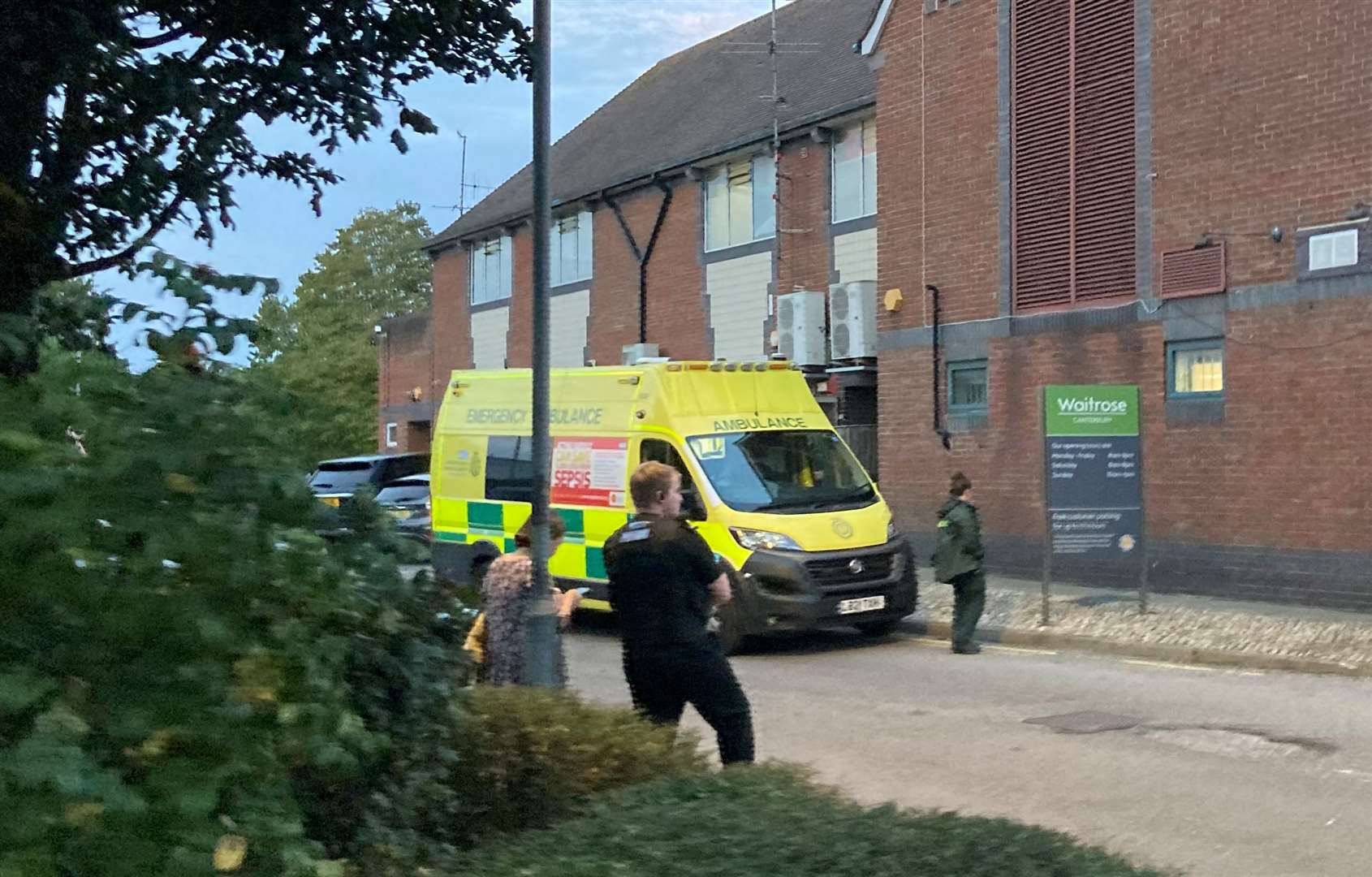 One of the police officers present, with an ambulance, at the scene behind Waitrose in Canterbury