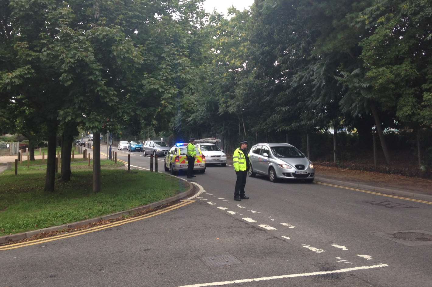 Police close off a road near the crash