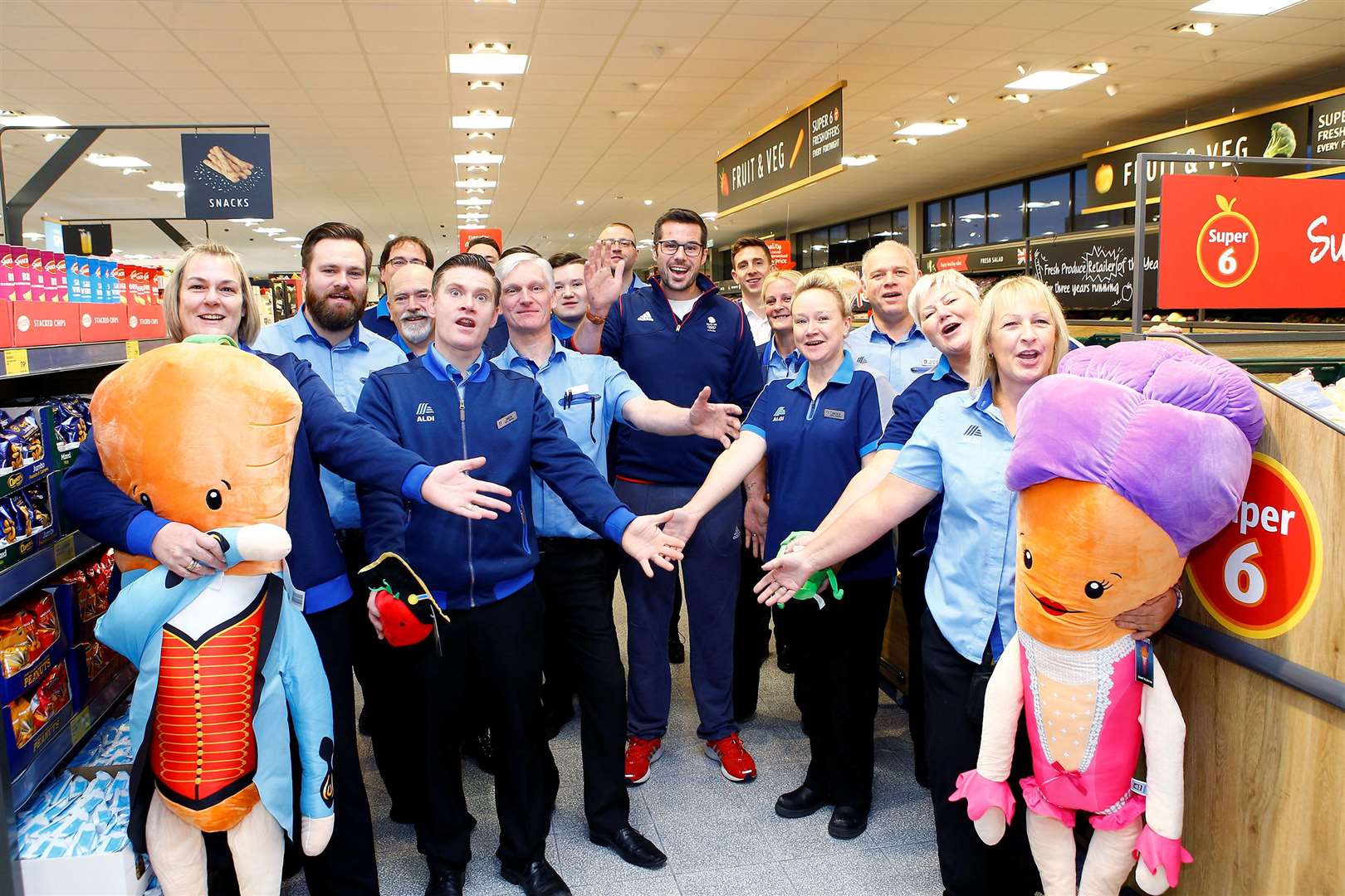 Store manager Julian Baker with Olympian James Foad and collegues Picture: Matt Bristow (22793131)